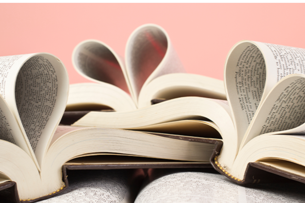 Open books with the pages curled into a heart shape