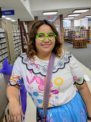 Miriam dressed as Mirabel from the movie Encanto.