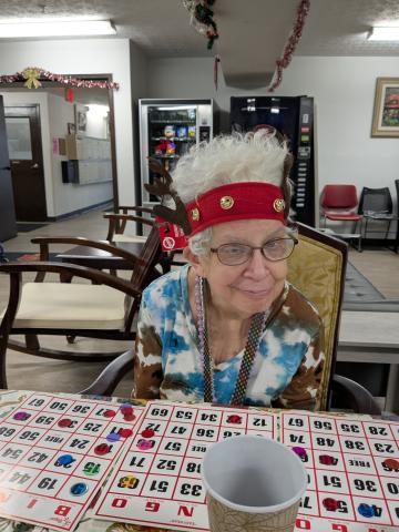 Cheryl wearing the reindeer headband she won playing BINGO.